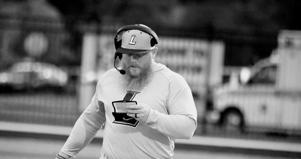 Friday night football game coached by Brandon Compton